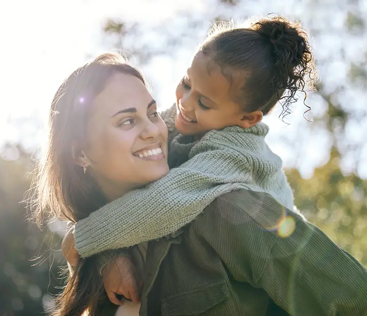 Mom with daughter are  smiling